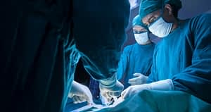 Surgeons Performing A Laminectomy